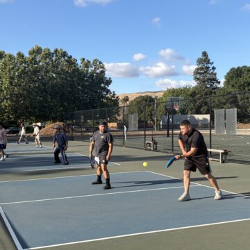 People playing pickleball on a court in San Jose, California