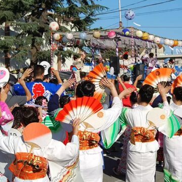 Japantown People waving fans at a Japantown cultural festival in San Jose, California